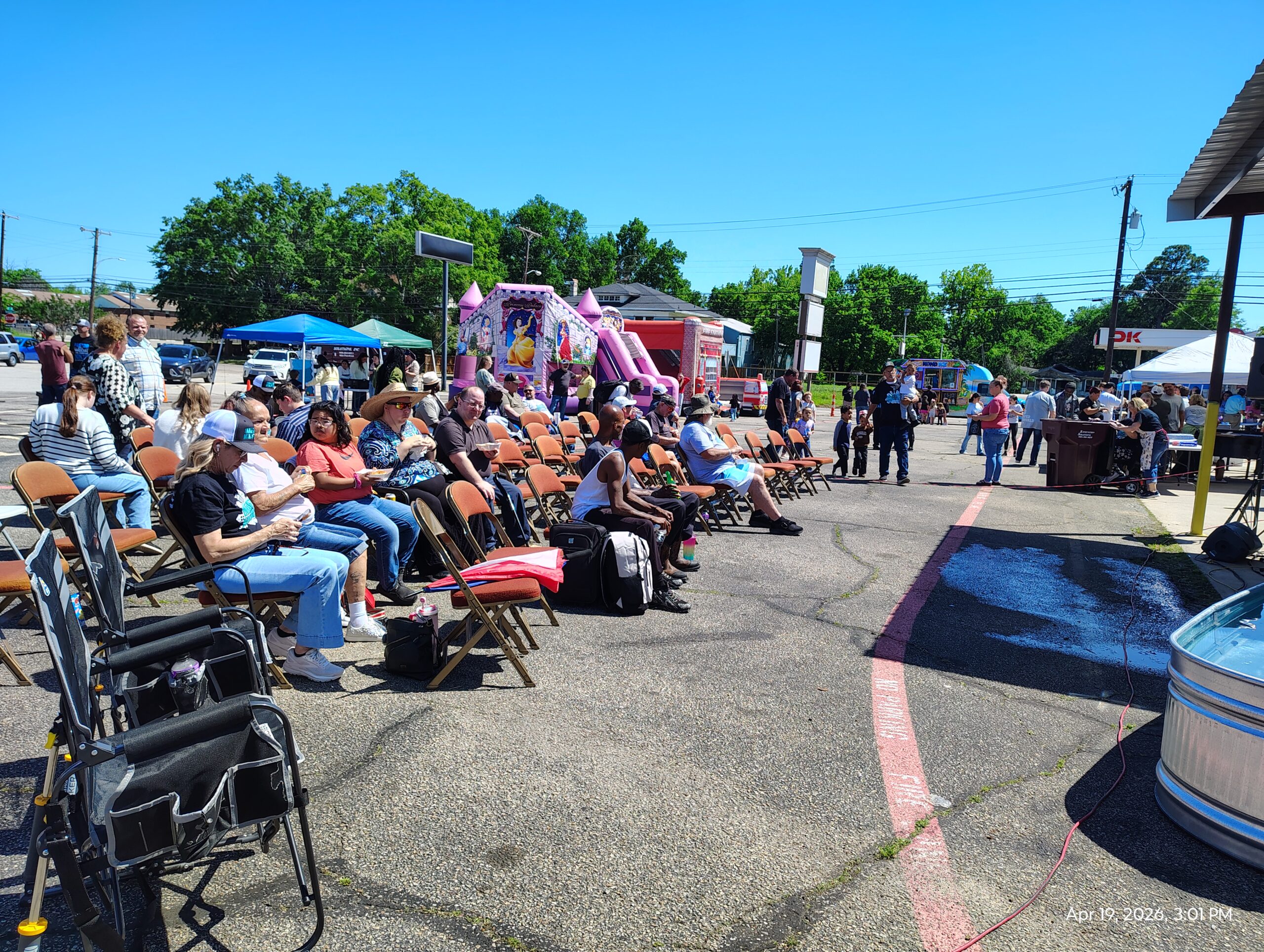 Families gathered outdoors for a community event.